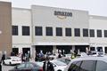 Amazon begins running temperature checks and will provide surgical masks at warehouses
